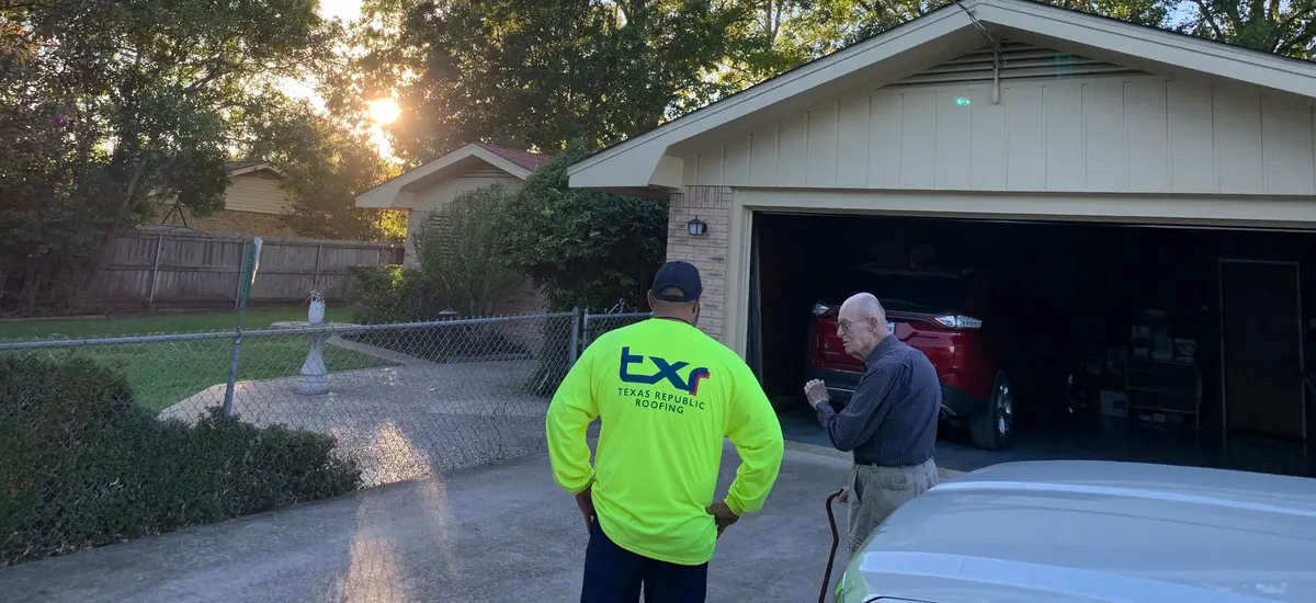 TXR team member reviewing roof inspection results with an Arlington homeowner