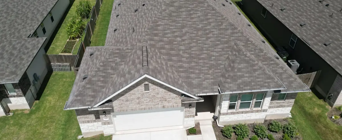 Aerial view of shingle roofs on a residential street near Pantego, Texas