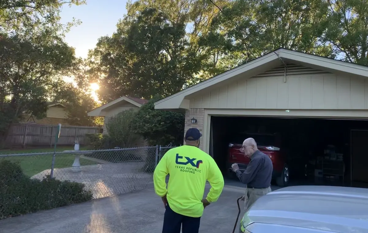 TXR team member meeting a homeowner in the driveway