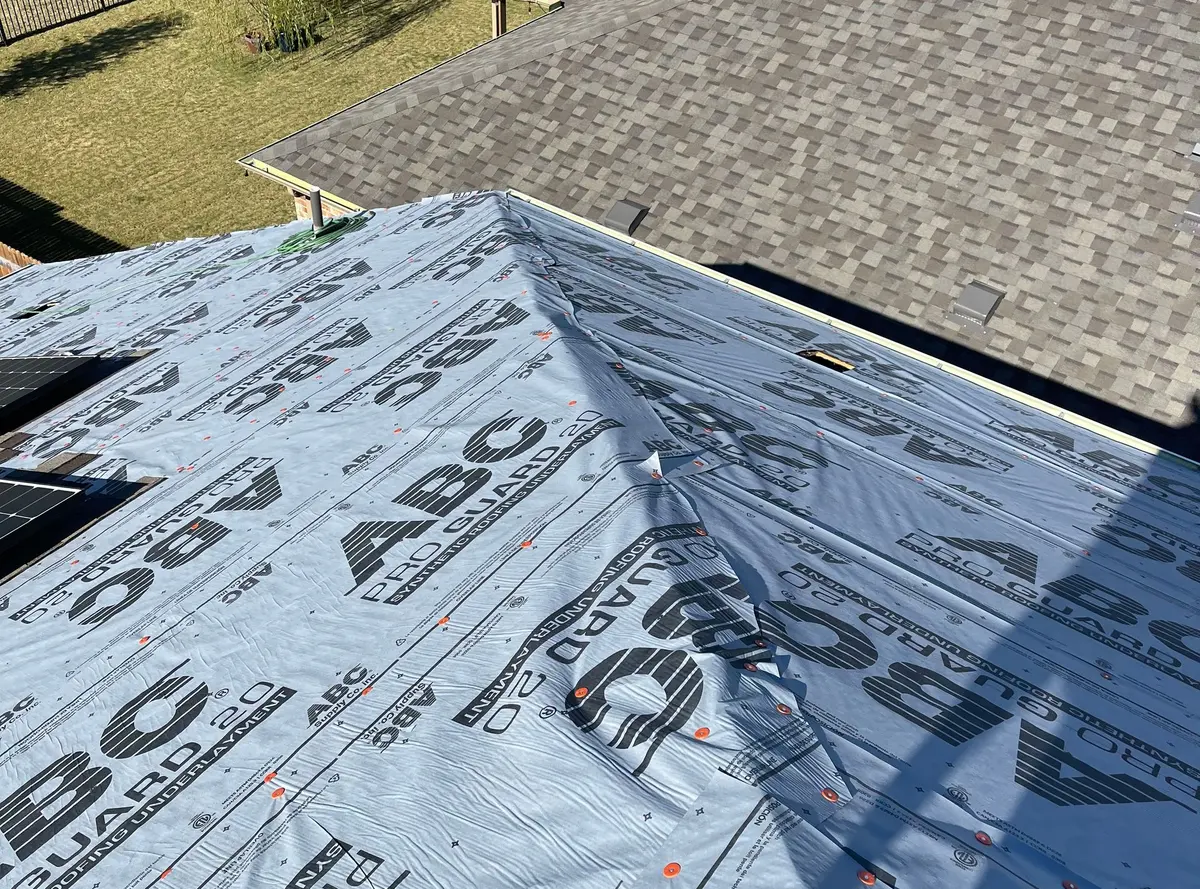Synthetic underlayment on a roof deck